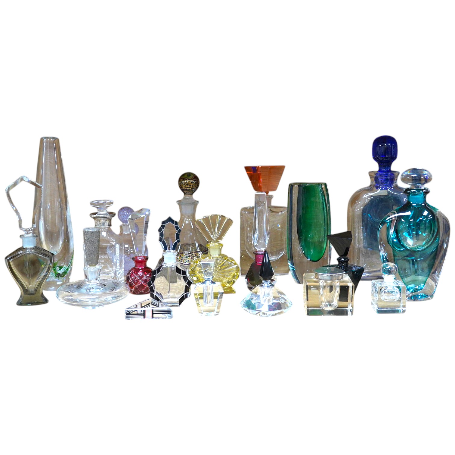 Eighteen glass scent bottles, two silver mounted, tallest 24.5cm, and a glass vase. Condition - good